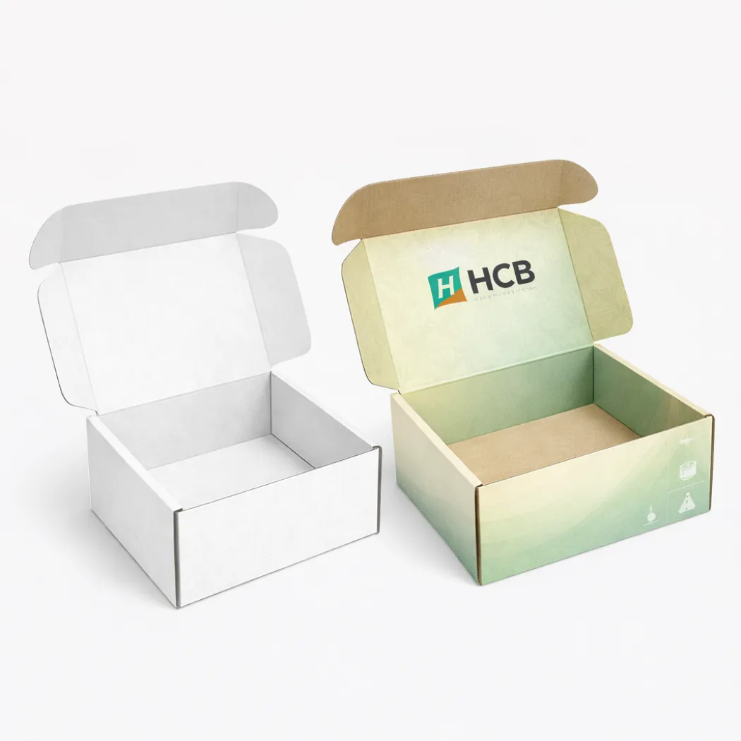 Open bespoke mailer boxes featuring a plain white design alongside a green branded version- class=
